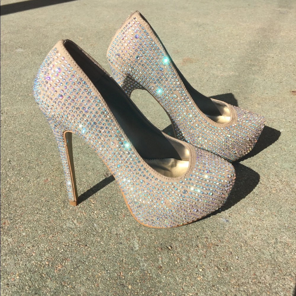 Nude high heels embellished with crystals.